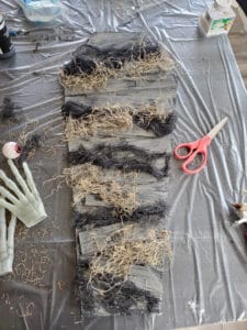 Halloween coffin craft with black creepy cloth and Spanish moss