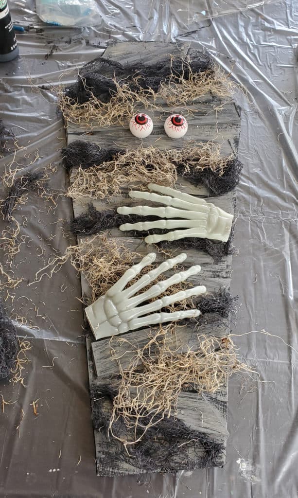 DIY Halloween coffin craft with scary eyes and creepy hands