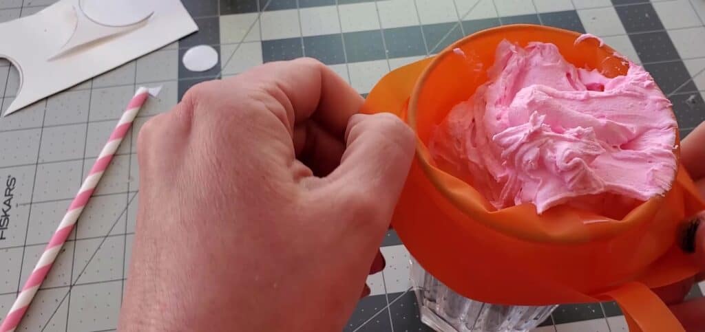 Place fake whipped cream into piping bag