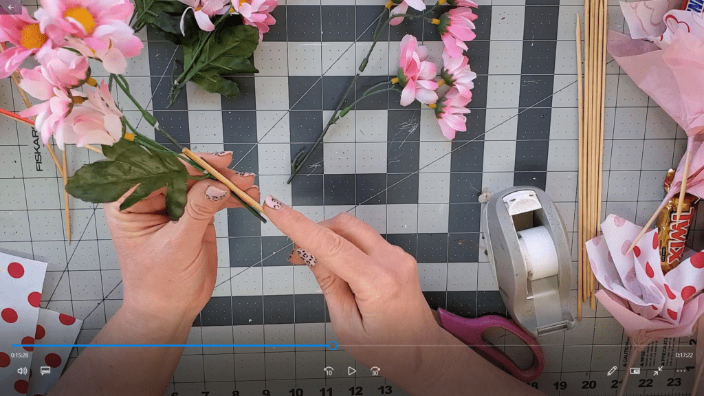 attach fake flowers to skewers