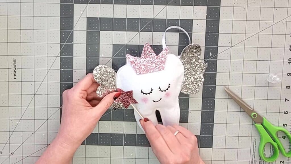glue wand onto tooth fairy pillow