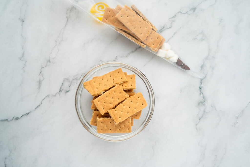 adding graham crackers to first day of school goodie bags